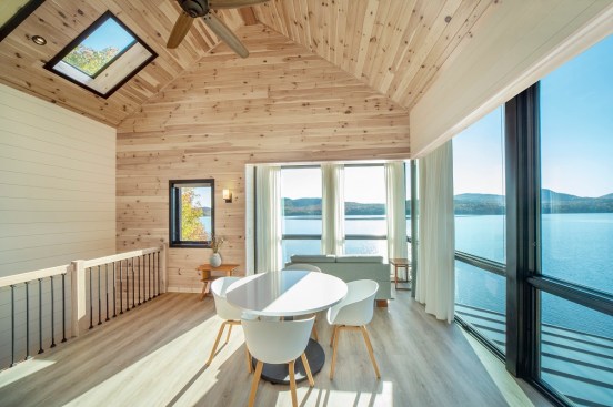 Entering the home on the top level, the space opens into a main living area and kitchen.