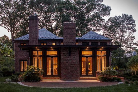 To address the owners' need to entertain guests, Muse Architects designed a contexual addition for this brick house that creates more rooms and opens up spaces. A new family room extends into the yard behind the home.