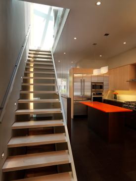 After: The new staircase was moved to the middle of the house and its transparent design allows light to reach deep within the remodeled home.   2011 Remodeling Design Awards (September)  Whole-House Remodeling $250,000 – $500,000  Kube Architecture, Washington, D.C.