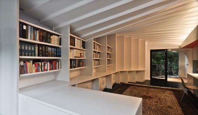 Builder David Bond eventually had to frame this undulating roof himself.  “We usually can cut every rafter the same, but here every rafter had to be cut with four different angles to make it work,” he explains. “The biggest challenge was making the tails of every rafter line up with a straight fascia board.”