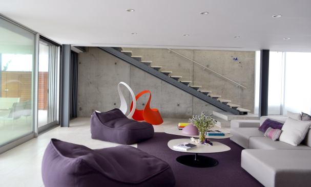 Sliding doors on the ground floor of the home open the space to the patio.