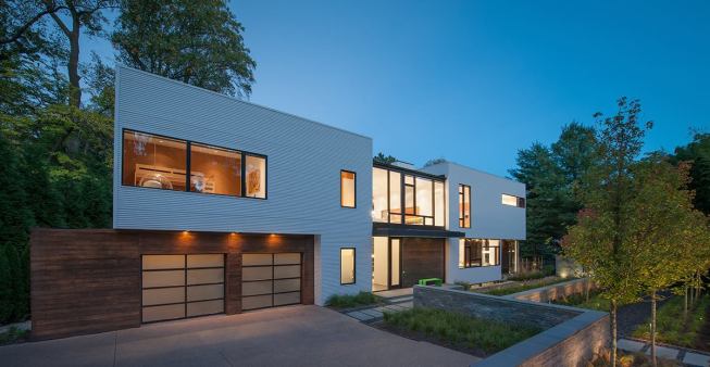 Varied siding materials accentuate setbacks in the entry facade.