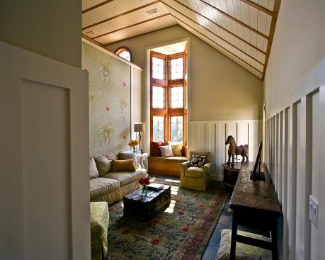 Off the main entry is a cozy den, with a window seat that looks out onto the nearby vineyards.