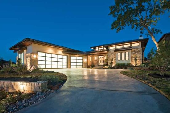 10. Hill Country Neo-Prairie: The unique C-shaped layout of this 4,237-square-foot home is positioned around a side courtyard that creates oh-so-lovely privacy on not-so-private lots. Neat details like the pivot front door, room for a hanging bed in the master suite’s covered pavilion, and an entry tower set this modern home apart in our top ten. For images and information, click 
here.