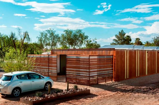 The roof slopes toward each side elevation to direct water along twin shales and carry all runoff into the backyard.