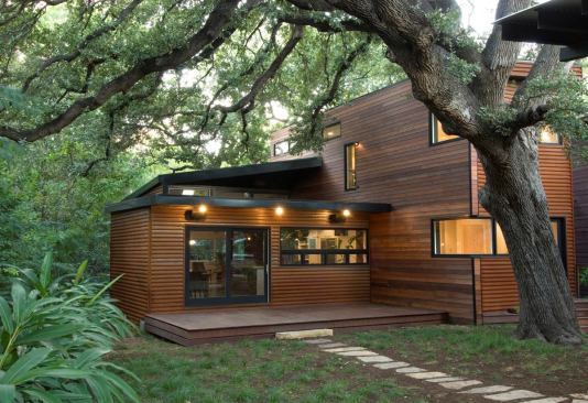 A collaboration between architects Christopher T. Cobb and Camille Urban Jobe, Eva Street is a 2,145-square-foot SIPs house with Corten steel cladding. The home is outfitted with tankless water heaters, dual-flush toilets, and bamboo floors, among other green features.