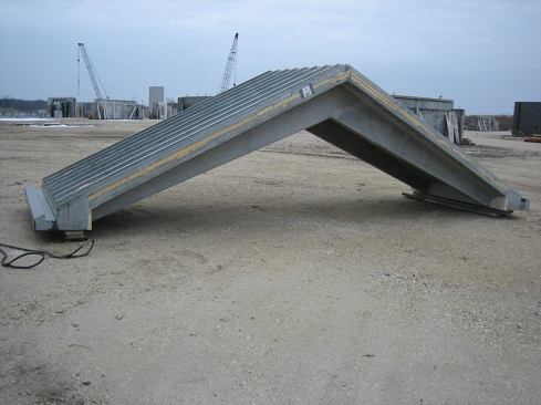 The finished roof section shows the texture simulating a metal roof and integrated rain gutters.