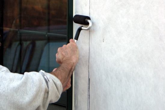 I always use a J-roller to apply strong, even pressure to the flashing tape.