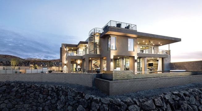 The New American Home makes the most of its sunny locale with plentiful windows and sliding doors that optimize natural daylighting and help reduce energy costs. To limit heat gain, designers speced deep shade-producing overhangs, recesses for windows and doors, and ultra-efficient Bayseal spray foam insulation from Bayer MaterialScience.