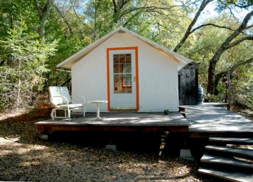 Siding is made of flame-resistant polyester vinyl. The roof is canvas so the structure can breathe.