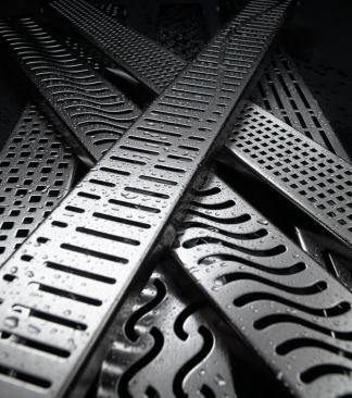 The linear QuARTz Drain by ACO is available in eight grate styles, two finishes, and six standard lengths. A stainless steel sieve/strainer sits inside a 2-inch diameter outlet to collect hair and debris. http://www.quartzbyaco.com.