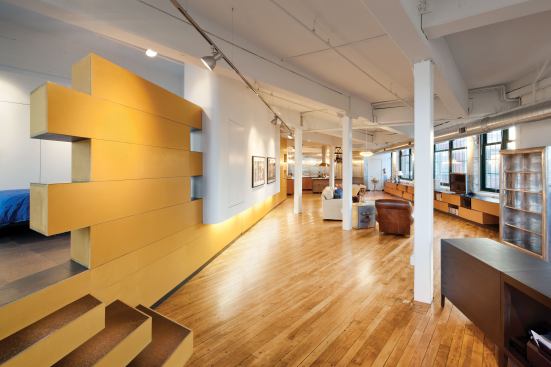 3six0 Architecture removed layers of carpet and acoustical ceiling tiles to convert this factory building into a loft with two separate living areas.