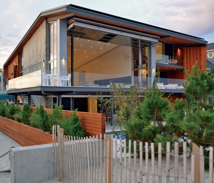 Located southwest of Mantauk and the Hamptons, this 6,000-square-foot home reinteprets the beach house as a modernist/industrial confection.
