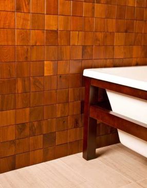 Instead of cutting down perfectly good trees, the manufacturer reclaims and salvages old barn wood and cabinet scraps to make its line of Re-Grained decorative wood tiles. Tiles are available in such species as alder, cherry, hickory, and walnut, and measure 2 inches by 6 inches, 2 inches by 2 inches, and 4 inches by 4 inches. 
http://eandstile.com.