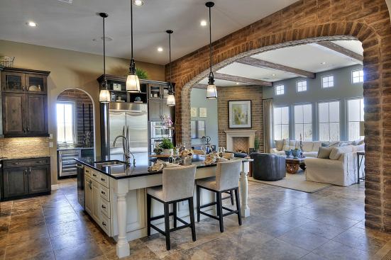 This home at Quisana in Scottsdale, Ariz., offers an example of the spacious linked kitchens and great rooms in Standard Pacific's new home designs.