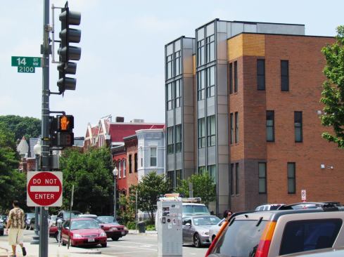 Contemporary structures attempt to blend in with traditional row houses along the side streets.