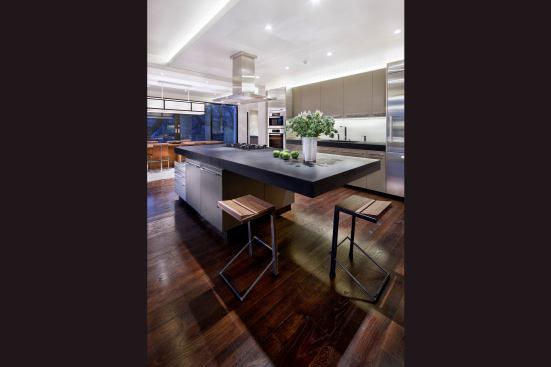 For this kitchen remodel, the clients asked for a centralized hub for entertaining. Seating makes good use of the island’s corner spaces. Project: Mountain Villa Residence, Austin, Texas; Designer: Tamie Glass and Ulrich Dangel; Builder: Pilgrim Construction