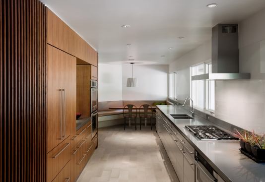 Clients downsizing from a large family home to a small, single-story one still needed seating space in the kitchen—but not as much as they previously had. Project: Barranca Residence, Austin, Texas; Architect: Alterstudio Architects LLP; Builder: Pilgrim Building Company