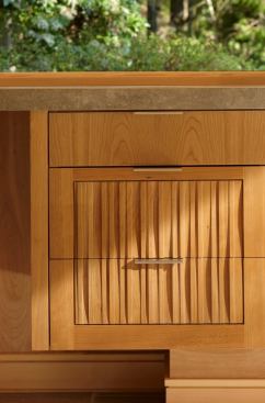 Cabinetry throughout the house bears a CNC-milled panel of Finne’s design.