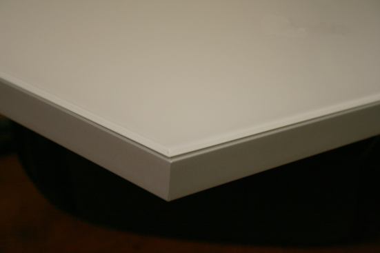 Set to be released soon, the AF010 features an aluminum frame profile with a beveled opaque glass covering the entire frame. The door can be custom ordered in 1/16-inch increments. 
www.element-designs.com.