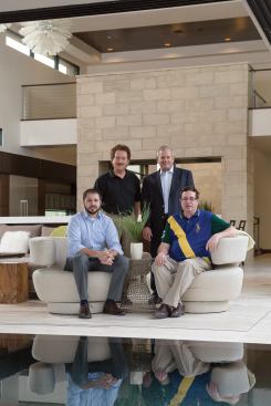 From co-producer NAHB, Tucker Bernard (standing, left) directs the association’s Leading Suppliers Council and New American Home program and Christopher McLarty (seated, left) manages council membership and retention. Builder John Ted Mahoney III (seated, right) chairs the program’s 2013 task force with vice chairman and builder Alex Hannigan (standing, right).