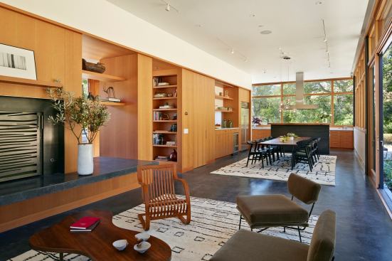 The fridge, just around the corner from the work area, lightens up the cook's space and integrates a service area into the entertaining space.