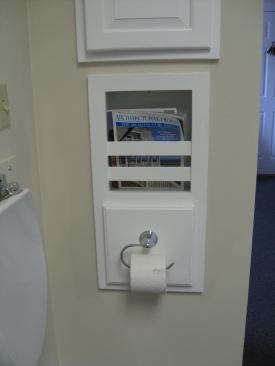 A built-in bathroom magazine caddy and storage area behind the toilet paper roll are some of the sought-after features Patco Construction includes as part of its quest to appeal to women buyers.