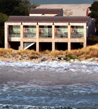 2004 CHDA  Custom Home, 3,000 to 5,000 Square Feet / Merit Award  Fisher-Friedman Associates   Each new house in this beach community just north of San Francisco works hard to satisfy a myriad of safety and building codes. FEMA regulations require homes to be lifted several feet off the ground in case of flooding; paradoxically, the local homeowners' association enforces a strict height limit. Foundations and framing must also meet strict earthquake standards. “At Sea Drift you can't have a two-story house, so there was a 9- to 10-foot envelope between the floor and the roof to design in,” says architect Randy Friedman. “You can do pop-up roofs, so we did a barrel vault over the living and dining rooms and the study.”