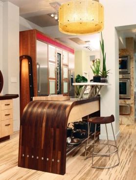 The fabricator specializes in highly custom wood countertops and islands. Almost any design is possible, and available species include ash, hickory, red elm, sapele, Lyptus, and zebra wood, among many others. 
www.engraintops.com.
