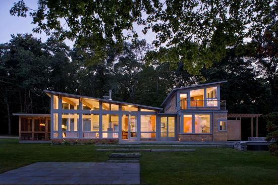 Located on the shore of Rhode Island’s Narragansett Bay, the Pojac Point Renovation began with a shed-roof cottage built in the 1950s.