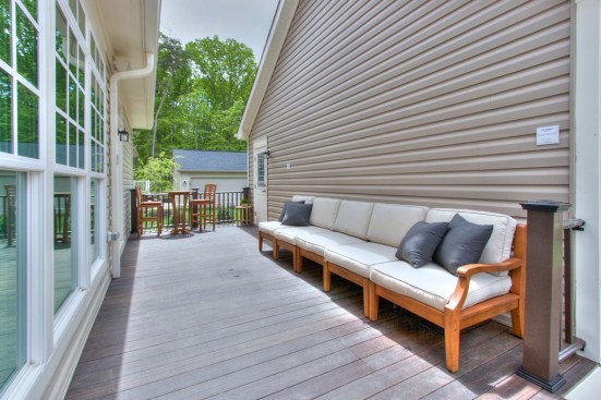 Graywater recycling and rainwater collection systems feed into water storage tanks are located under the deck, which connect to the irrigation system.