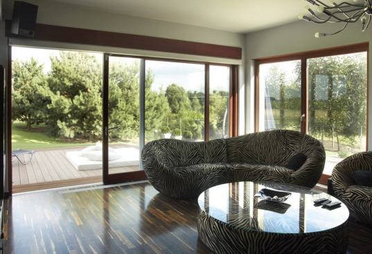 Your windows aren’t the only ones that can have triple glazing. Available in sizes up to 20 feet wide and 8 feet tall, these doors feature triple glazing, warm-edge spacers, and German hardware. Doors can be specified in all-glass, thermally broken aluminum frame, and pine, meranti, and oak cladding. www.zolawindows.com.