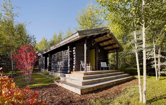 Another view of the entire cabin with the addition in the back where the roofline changes.