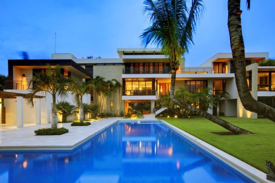 Providing a warm winter retreat for a Midwestern family, this home boasts views of the Gulf of Mexico to the west and the Intercoastal Waterway to the east. A pool leads up to the front elevation and sets the tone for the surrounding water views. Project: Private Residence, Osprey, Fla.; Builder: Michael K. Walker, Sarasota, Fla.; Architect: TOTeMS Architecture, Sarasota