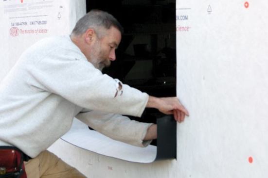 ...then lower it onto the sill and press it into place, working from the middle toward the corners.