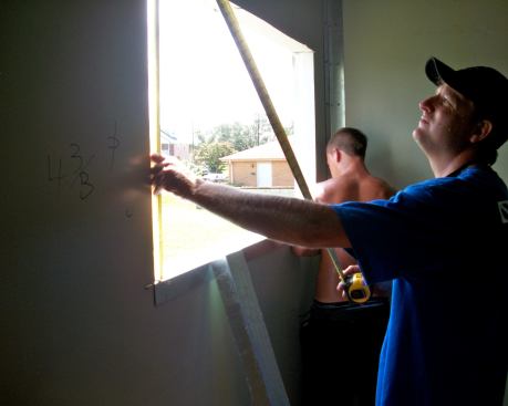 Subs cut spaces into insulated panels for windows. Some 60 vendors donated products and installation services for the project.