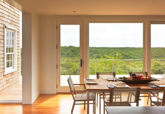 A sea of green makes the inland prospect as compelling as the view toward the dune.