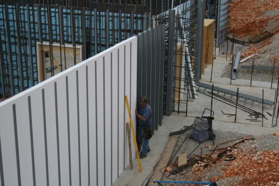 Tall Order: The 4-inch-thick exterior panels are held up by steel framing, and the concrete pored within is fortified by a high-performance steel fiber helix called Polytorx.