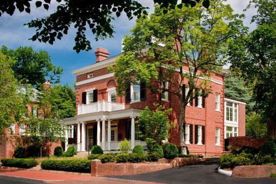 Exterior work for the restoration of this 1893 mansion included restoring the front porach and roof-top widow's walk--both of which had been removed in the 1960s.