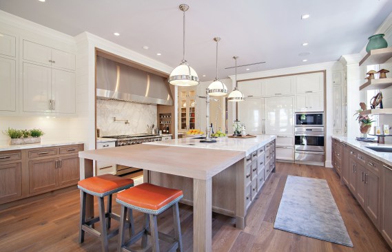 Marc-Michaels attached a table to this island to form a "combination island" to give the family more hang out space.
