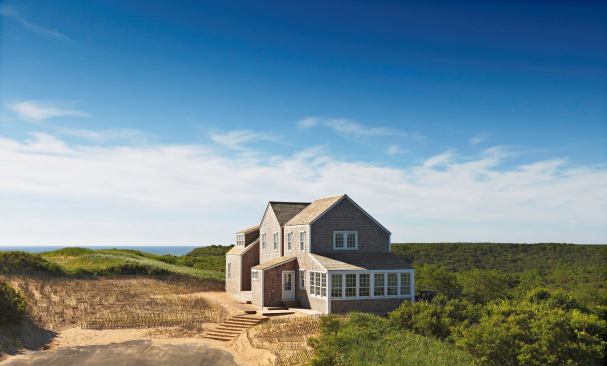 Approached from the driveway, the house suggests a tightly clustered group of vernacular cottages.
