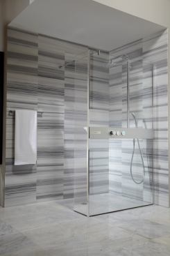 TOTO’s NEOREST shower booth lets users control water volume and temperature from inside and outside the shower. The zero-clearance shower is available with left- or right-side installations. TOTO, www.totausa.com; 888.295.8134.