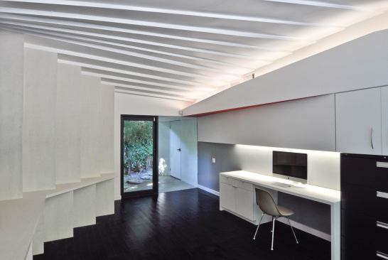 Bond adds that the complexities didn’t end with the unique rafters. Both the plywood and finish drywall sheets had to be cut to fit and slightly bent to give the effect of a curved surface. “You get this perceived sloping effect like there’s a curvature,” he says, “but there’s really not a curve anywhere.”