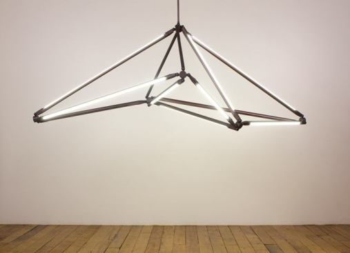 The SHY Light features thin LED tubes that define the edges of its shape, and modular hardware that allows it to be reconfigured in different ways. As a result, the form of the piece is determined by its function. 
www.becbrittain.com.