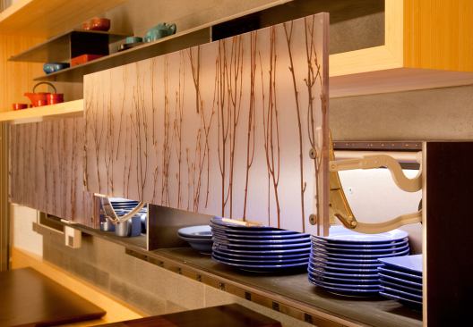 A china cabinet with eco-resin doors and LED lighting inside does triple duty as storage, decoration, and ambient lighting.