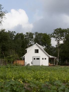 Located on an organic farm in East Austin, this new home has a traditional form with some modern details.