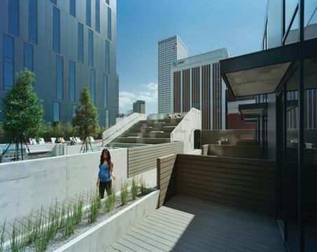 At the ninth floor of a downtown apartment building, a row of townhouse-style units faces an open terrace and pool deck.   2011 rada  930 Poydras Residential Tower, New Orleans  Merit Award/Multifamily  Eskew+Dumez+Ripple, New Orleans