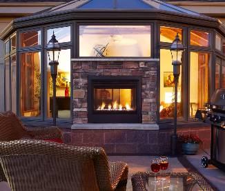 Heat & GloHeat & Glo’s two-sided gas fireplace gives
outdoor living spaces a contemporary look while offering two unique views of
the home and fireside. Twilight Modern splits the home’s exterior wall and can
be installed flush with the interior or exterior facing. Rated as a fireplace
and exterior window to facilitate installation, the unit employs 38,000 BTUs
powering flames that rise through colored class media—black, amber, and
crystal—while reflecting off of a black porcelain firebox. www.heatnglo.com.