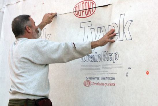 Cut the OpeningI start by making a level head cut in the housewrap...