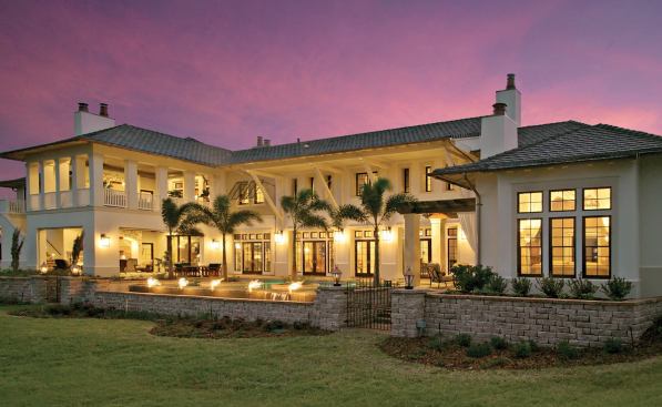 LAKESIDE: The rear elevation is as playful as the front, bookended by the master suite and stacked loggias that help shield the pool terrace while preserving dramatic and expansive views of the lake from inside the house.